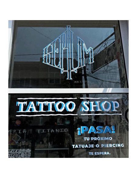 Rotulación comercial en vinil de corte azul y blanco para estudio de tatuajes